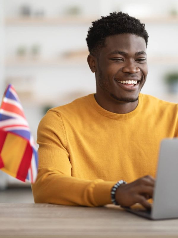 happy-black-guy-student-studying-at-language-school-online.jpg